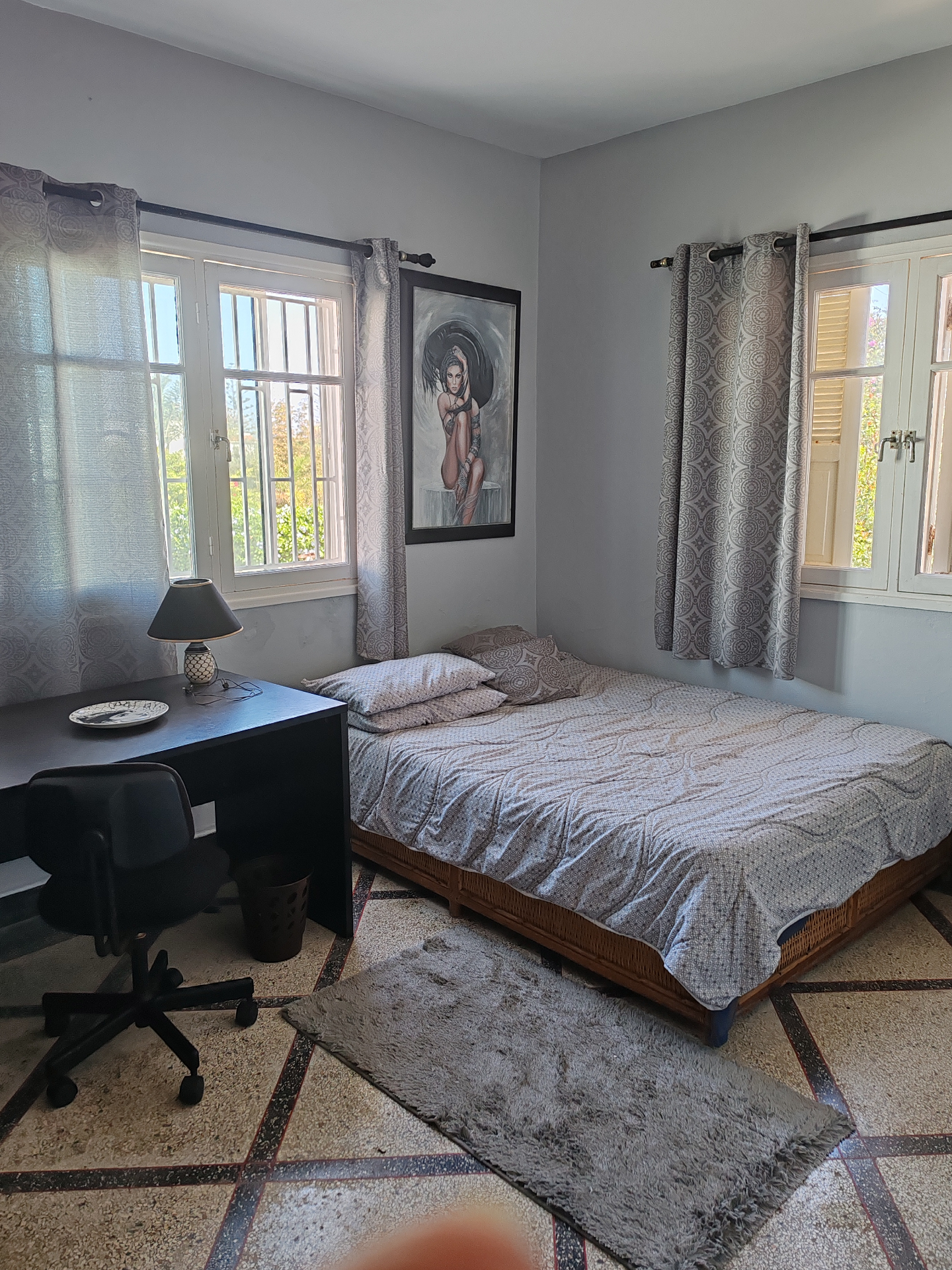 Second-floor bedroom — two windows and a desk beside the bed